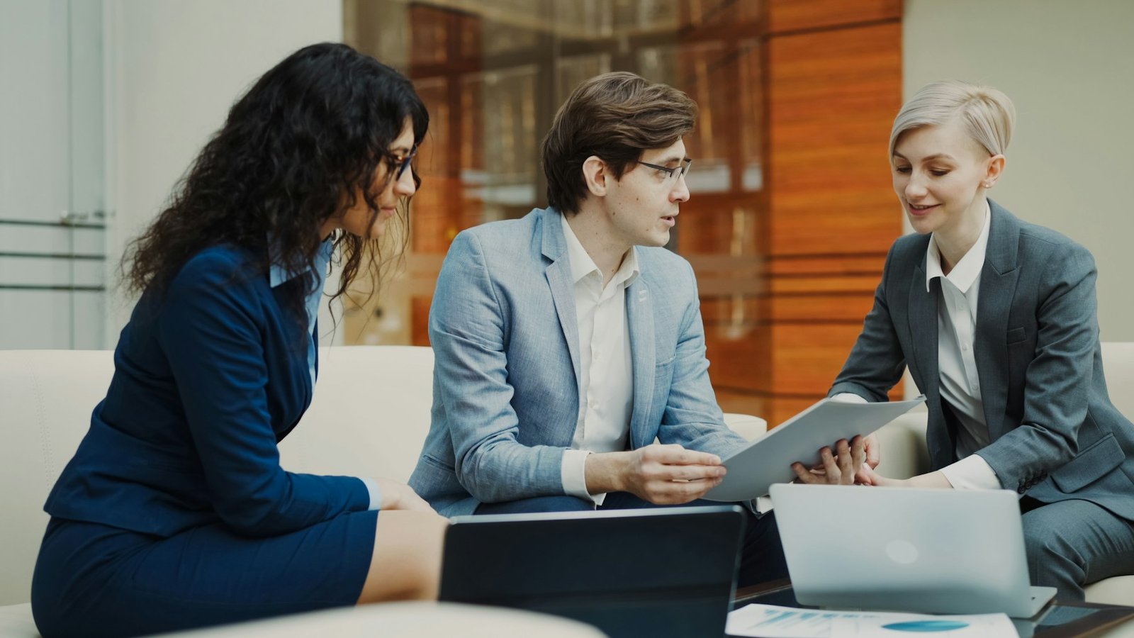 Advisors discussing a client plan in the office