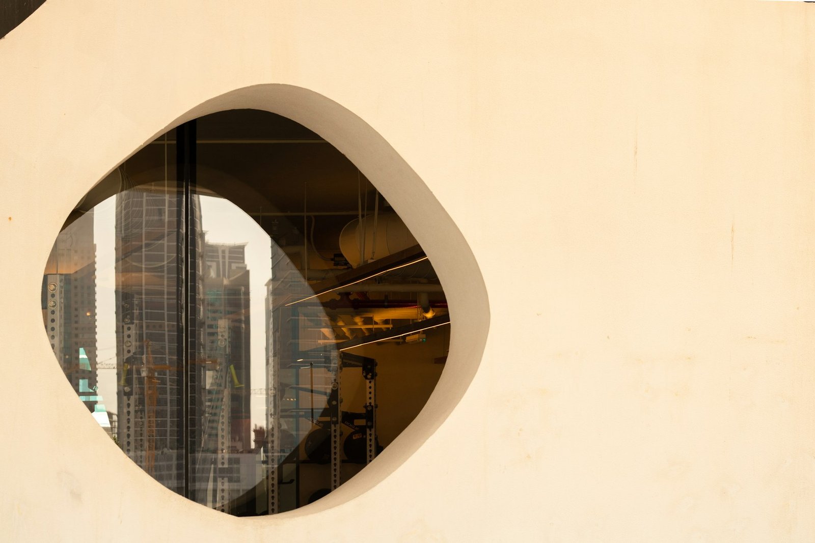 Dubai towers framed through a curved window