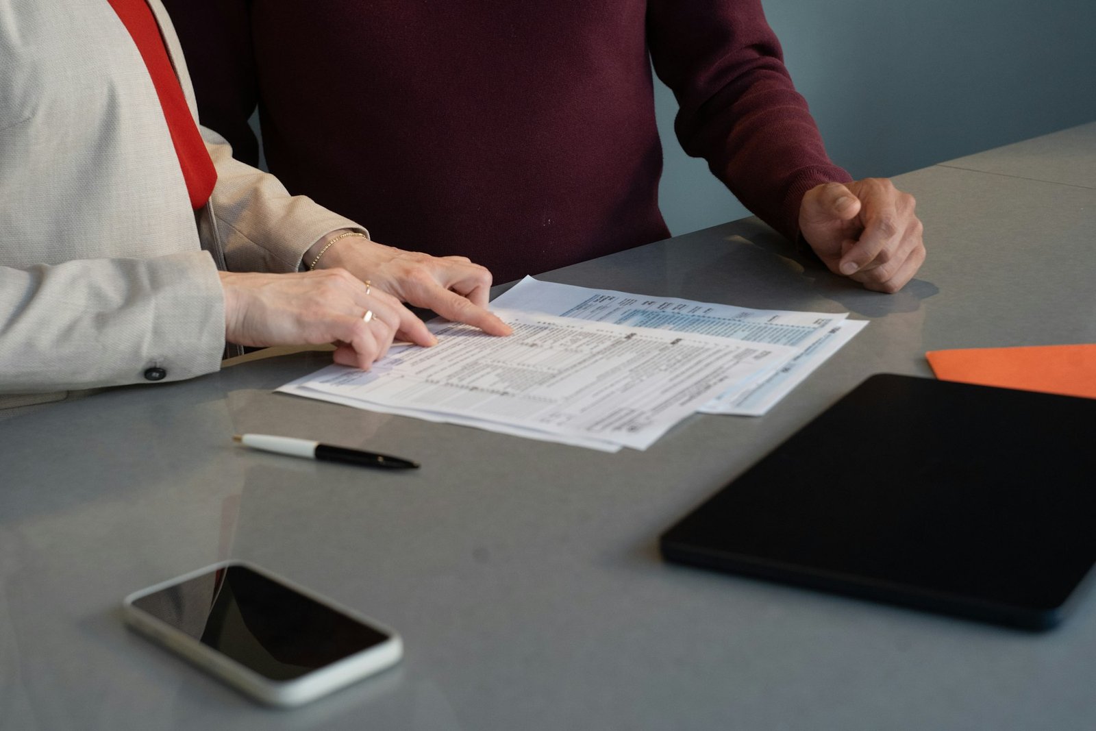 Advisor and client reviewing company documents